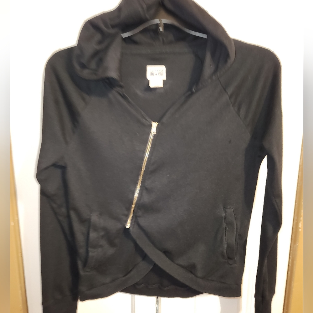 Black Converse hooded top/jacket with zipper and open style waist, with pockets.